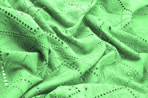 textura, patrón. Paño verde denso con agujeros perforados. Perforado a la perfección, que es el doble de divertido
! - Foto, imagen