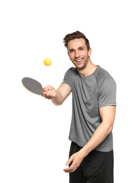 Молодий чоловік з тенісною ракеткою і м'ячем
 - Фото, зображення