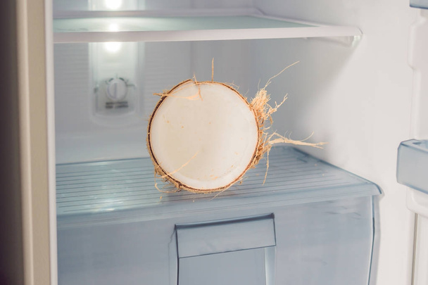 Coconut in the fridge. The Benefits of Coconut Water Concept - Valokuva, kuva