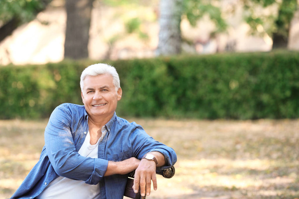 Handsome mature man in park - Photo, Image