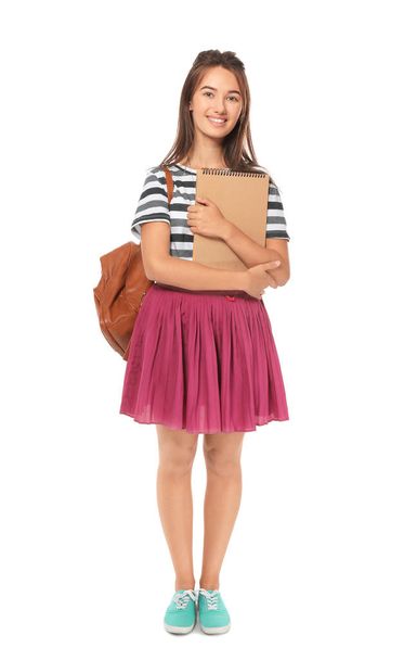 Cute teenager girl with notebook and backpack  - Foto, Bild