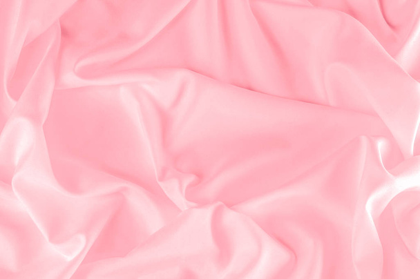 háttér textúra. pink selyem anyagból. A por rózsaszín selyem szőtt ad egy tavaszi romantikus aura. A szelíd hang bemutatja egy szatén-szerű arcát, sima és fényes.  - Fotó, kép
