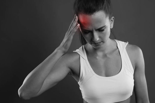 woman bw sport pain red  head studio shot dark bg - Photo, image