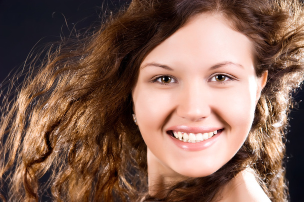 Young smiling woman with long hair - Foto, Imagen