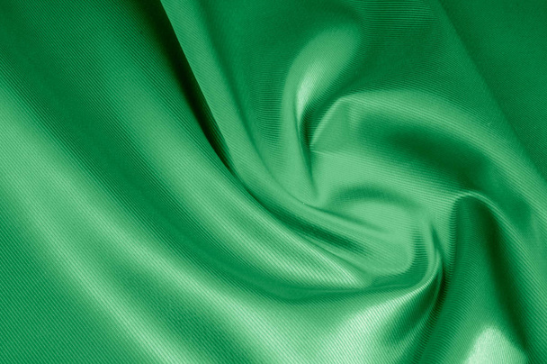 Texture, background, pattern. Texture of green silk fabric. Beau - Photo, Image
