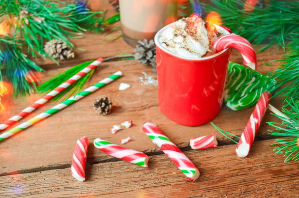 Hot chocolate with whip cream and peppermint canes - Фото, изображение