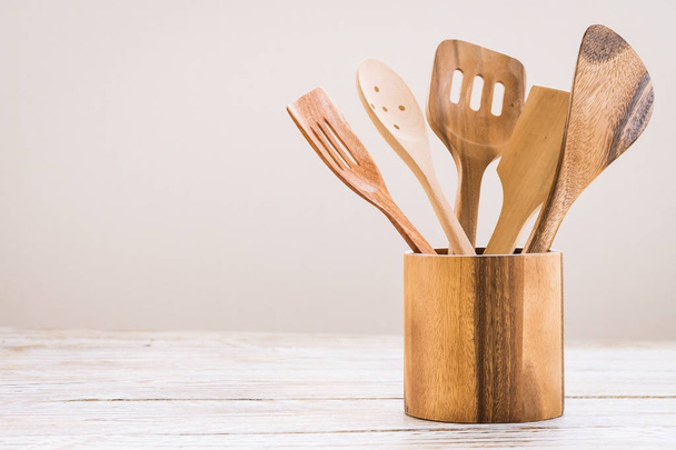 Wood utensils or kitchen ware on wooden table with copy space - Vintage Filter - Photo, image