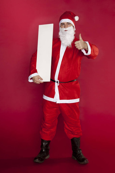 boldog santa záradék tartja a helyén, a reklám, hüvelykujját - Fotó, kép