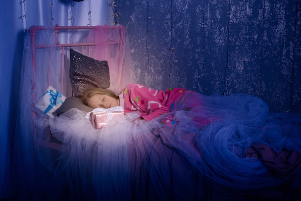 Teenage girl is sleeping sweetly, Christmas  - Φωτογραφία, εικόνα