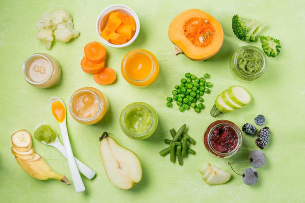 Colorful baby food purees in glass jars - Fotó, kép