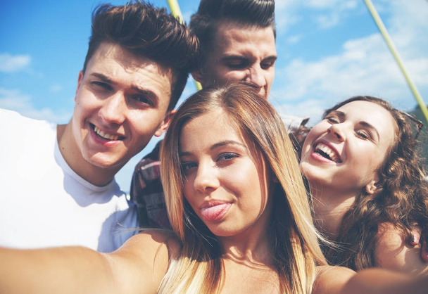 Selfie of group of teenage friends outdoor - Fotó, kép
