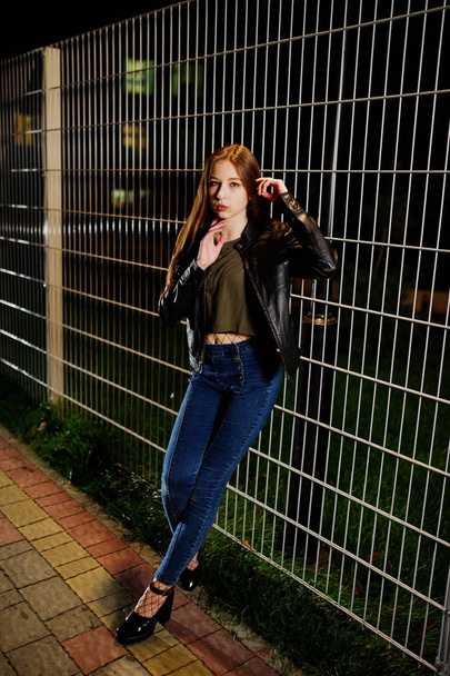 Night portrait of girl model wear on jeans and leather jacket ag - Valokuva, kuva