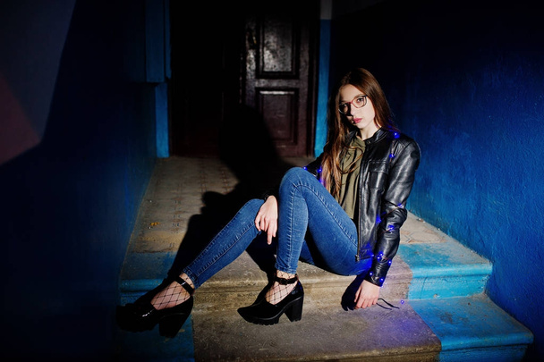 Night portrait of girl model wear on glasses, jeans and leather  - Zdjęcie, obraz