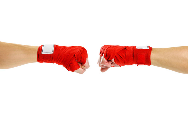 Hand in red Boxing bandages. Fist to fist. Two fists in red Boxi - Zdjęcie, obraz