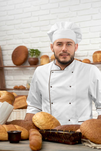 Young man working at his bakery - Foto, Bild
