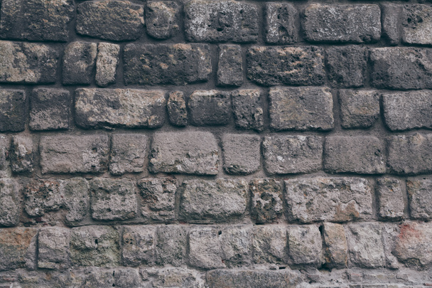 close-up shot of black aged brick wall for background - Photo, Image