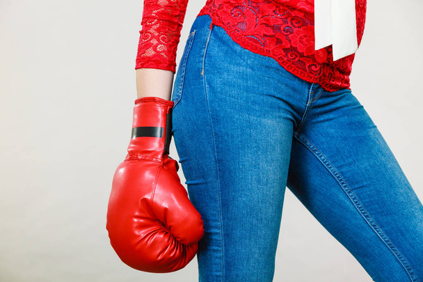 Woman wearing boxing glove - Photo, image