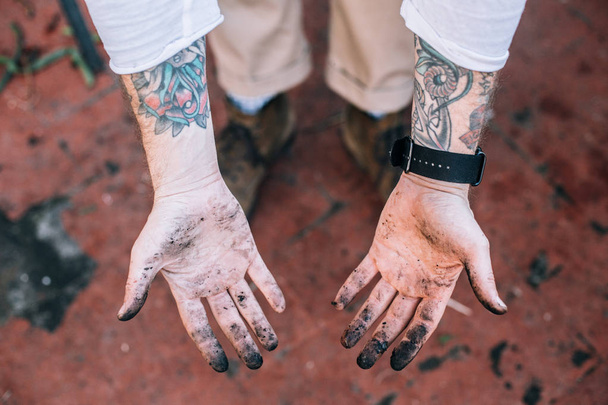 Man showing dirty hands - Photo, Image