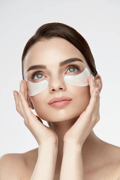 Beauty Face Skin Care. Woman Applying Under-eye Patches On Face - Photo, Image