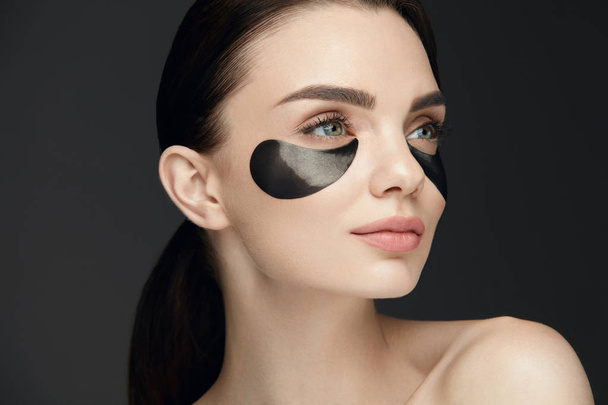 Woman Beauty Face With Mask Under Eyes - 写真・画像