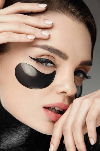 Fashion And Beauty. Female Face With Mask And Patches Under Eyes - Foto, Imagem
