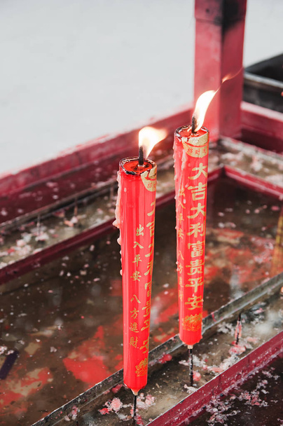 Burning Red Chinese-Style Candles at a Chinese Temple - Foto, imagen