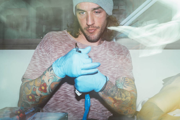 tattooist in the study of work - Photo, image