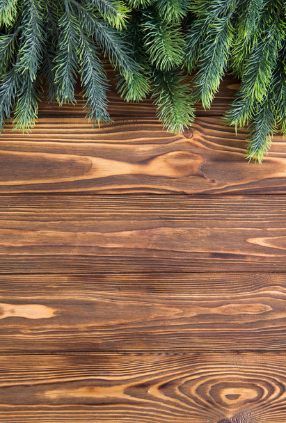 Christmas fir tree on the wooden board - Φωτογραφία, εικόνα