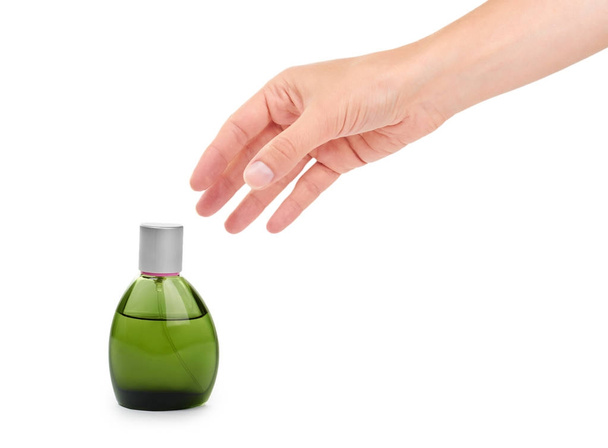 female hand holding perfume bottle. Isolated on white background - Φωτογραφία, εικόνα