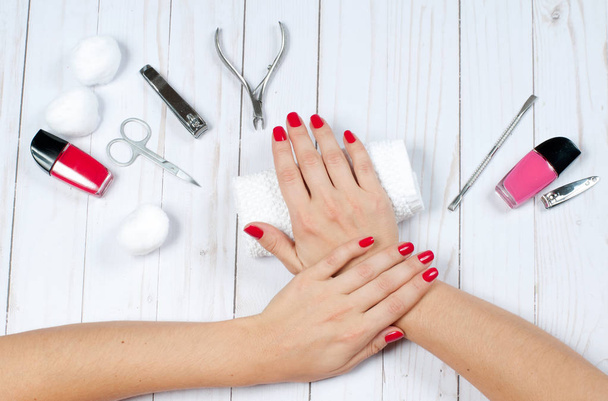 Beautiful female hands with nail polish. Red manicure - Zdjęcie, obraz