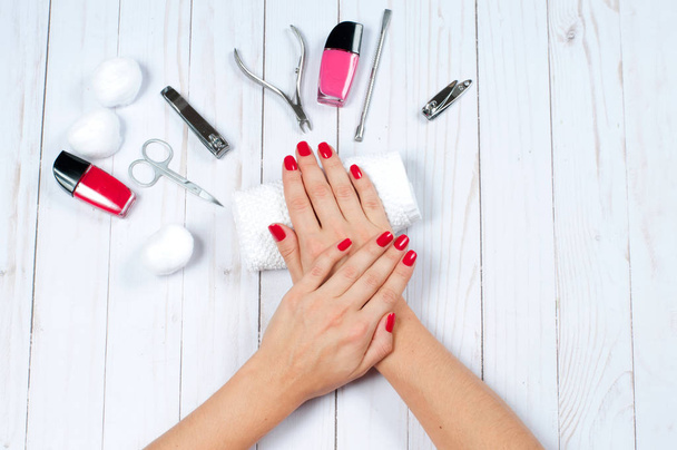 Beautiful female hands with nail polish. Red manicure - Φωτογραφία, εικόνα
