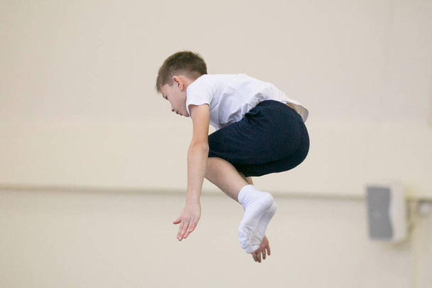 GOMEL, BELARUS - 25 November 2017: Freestyle competitions among young men and women in 2005-2007. In the program, trampoline and gymnastic path. - Fotó, kép