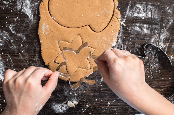 Cutting dough on different shapes.  gingerbread.  - Photo, image