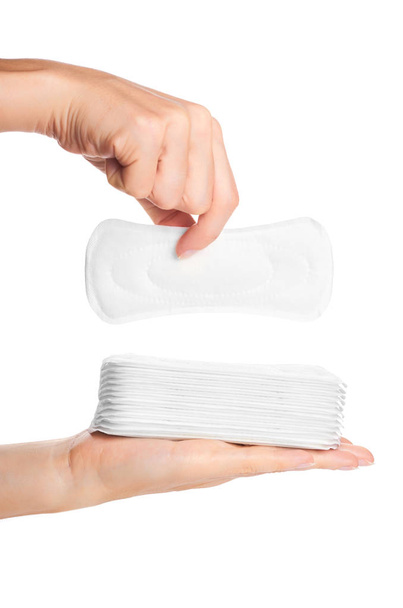 white sanitary napkin in hand isolated on white background - 写真・画像