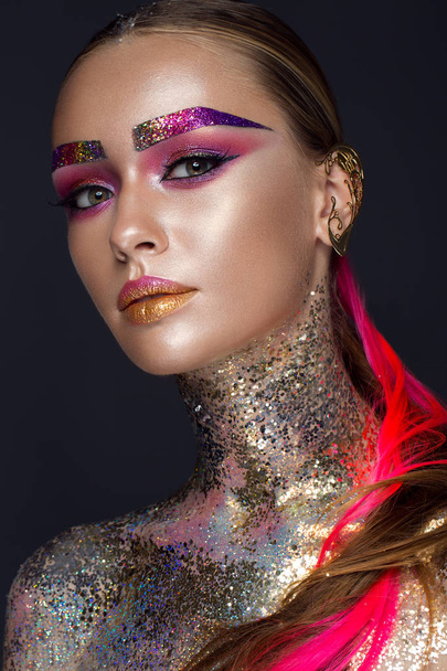 Beautiful girl with creative glitter makeup, sparkles, unusual eyebrows. Beauty is an art face. - Foto, afbeelding