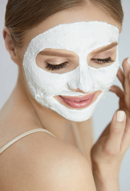 Skin Care Mask. Close Up Of Woman With White Face Mask - Φωτογραφία, εικόνα