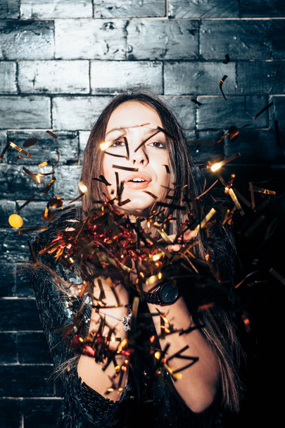 woman throwing golden confetti - Photo, image