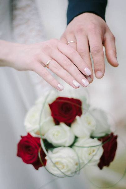 Bride and groom after ceremony showing wedding rings on their fingers. - Photo, Image
