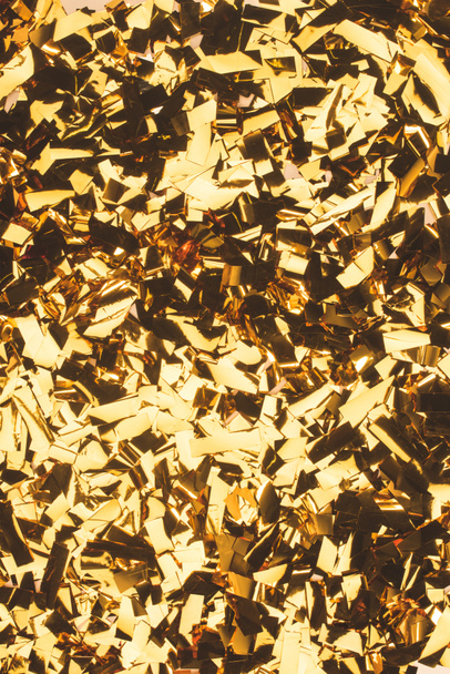close up view of sparking golden confetti - Photo, Image