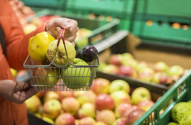 Buying apples and pears in shop. - Fotó, kép