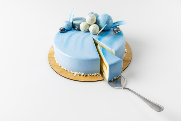 blue tasty cake on chopping board isolated on white - Photo, image