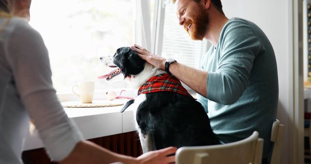 couple and loving their dog - 写真・画像