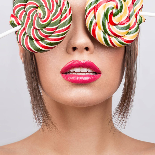 Beauty fashion model with colourful lollipops.  - Photo, Image