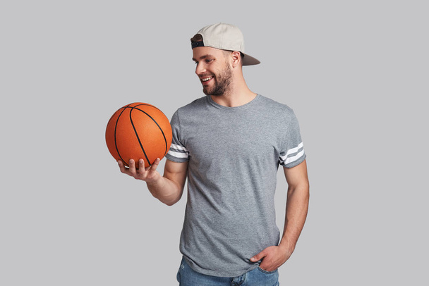smiling man carrying a basketball ball  - Photo, Image