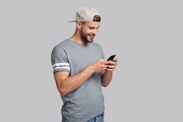 young man holding smart phone  - Fotografie, Obrázek