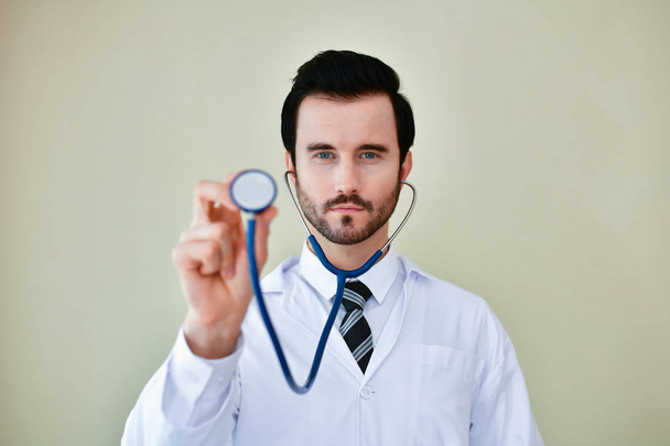 Smiling doctor posing in the office, he is wearing a stethoscope - Φωτογραφία, εικόνα