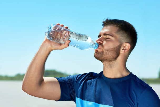 Man Drinking Water After Running. Portrait. - Zdjęcie, obraz