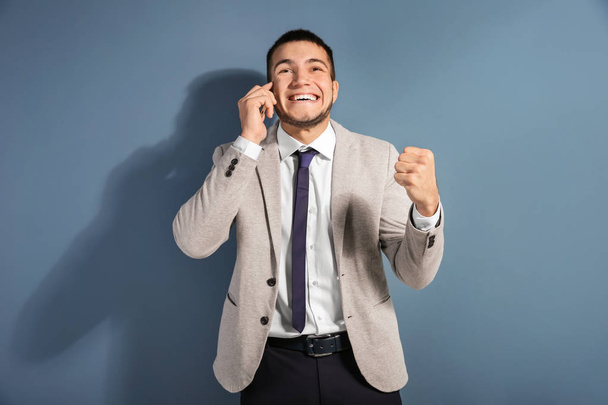 Happy man in formal suit talking on phone  - Фото, зображення