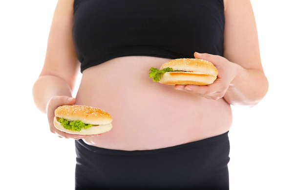 Overweight woman holding burgers  - Photo, image