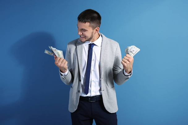 Emotional man in formal suit with money  - Foto, Bild